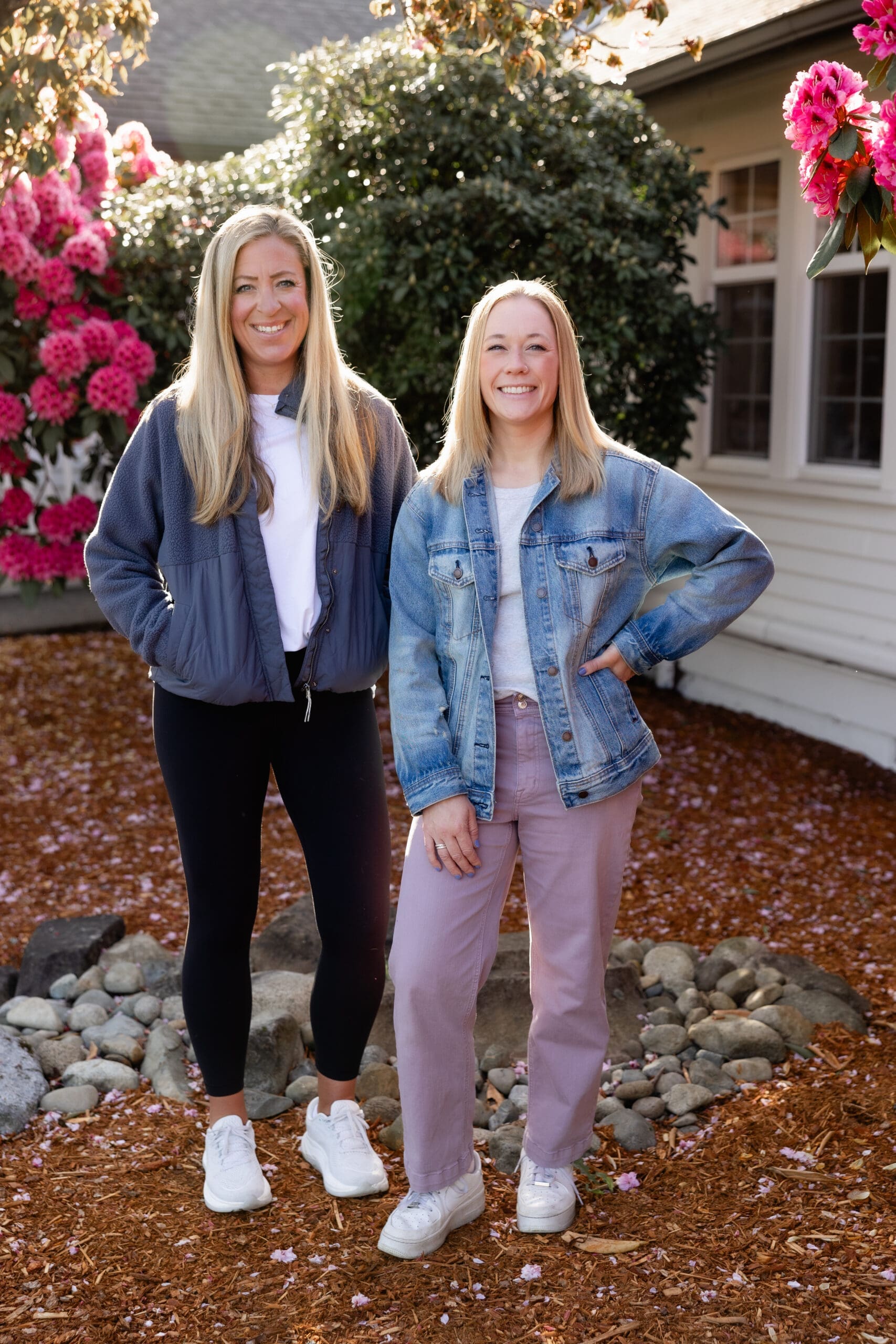 Two women smiling outside in the sunshine